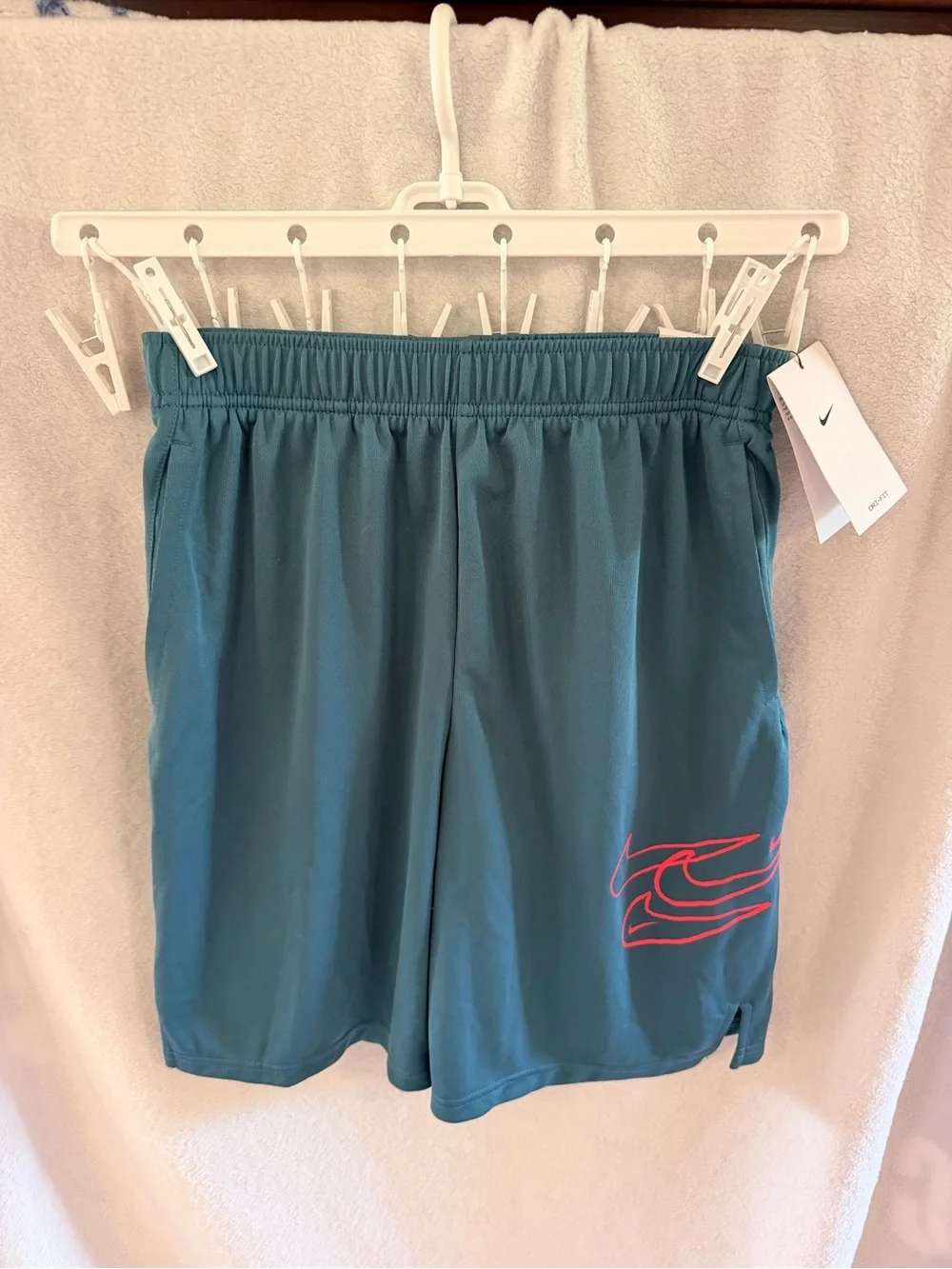 Nike Youth Teal Athletic Shorts with orange Logo Accent